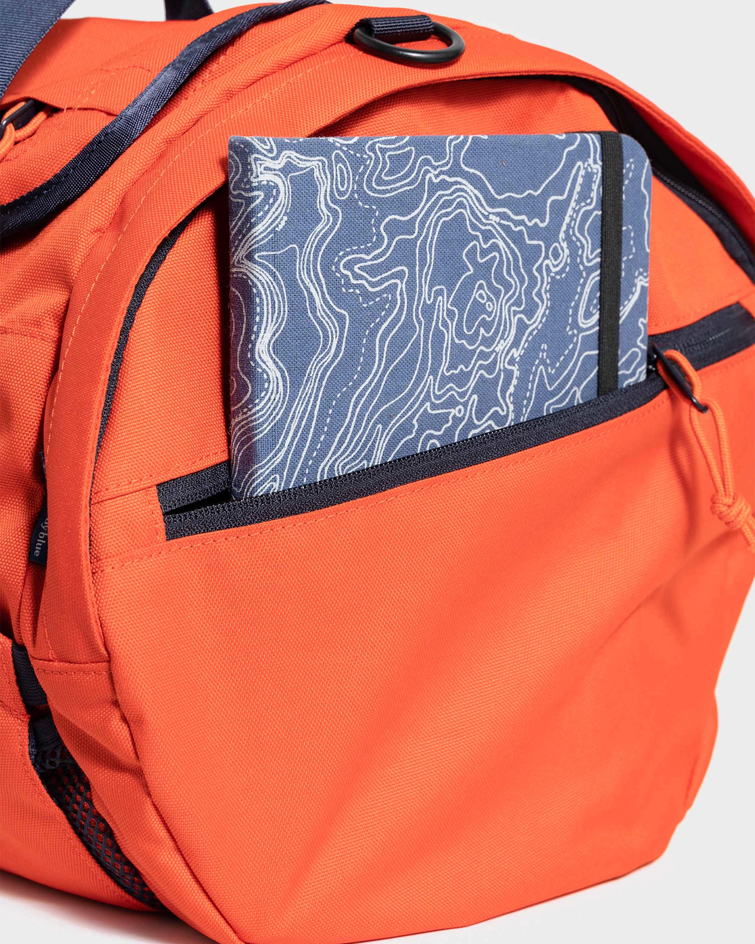 (R)evolution™ 27L Mini Duffle - Cardinal. Lakeside Camo