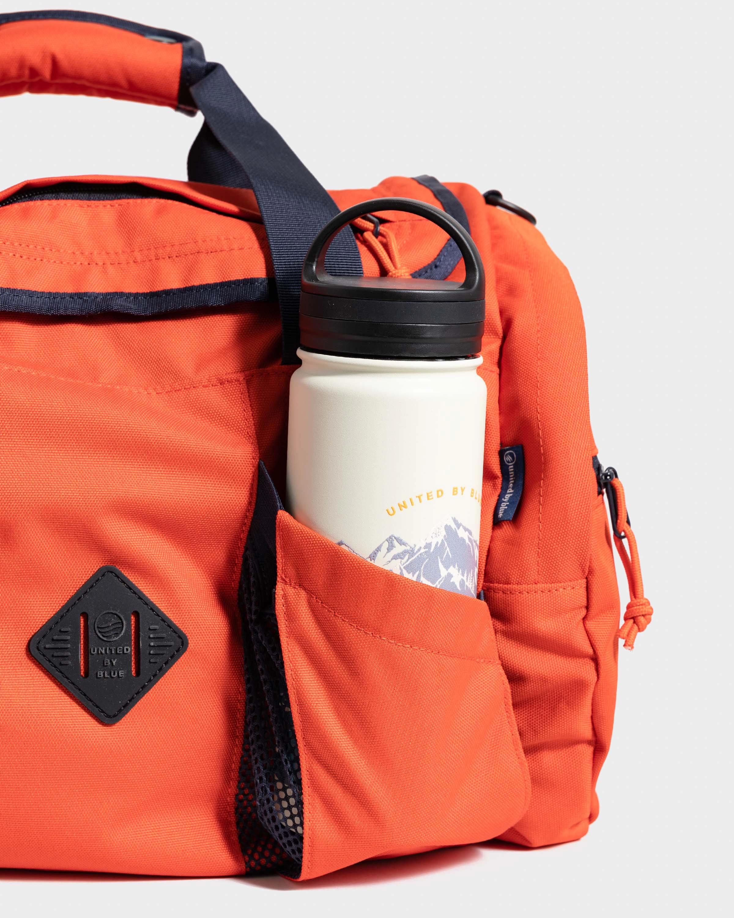 (R)evolution™ 27L Mini Duffle - Cardinal. Lakeside Camo