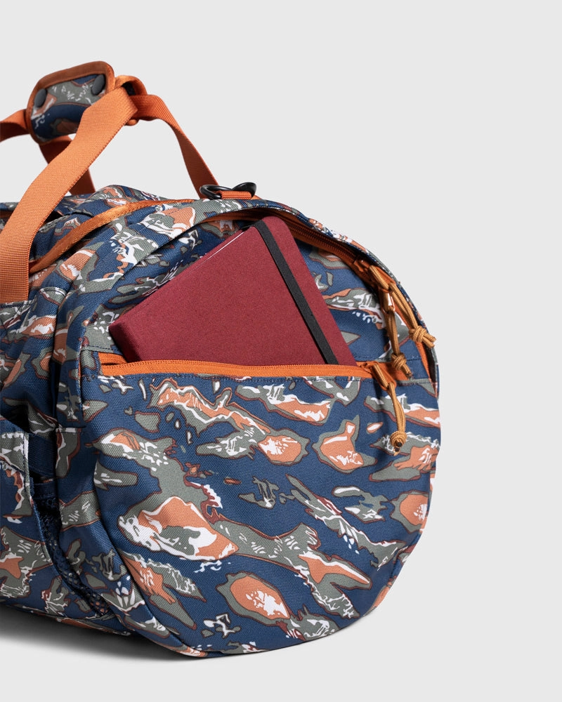 (R)evolution™ 27L Mini Duffle - Cardinal. Lakeside Camo
